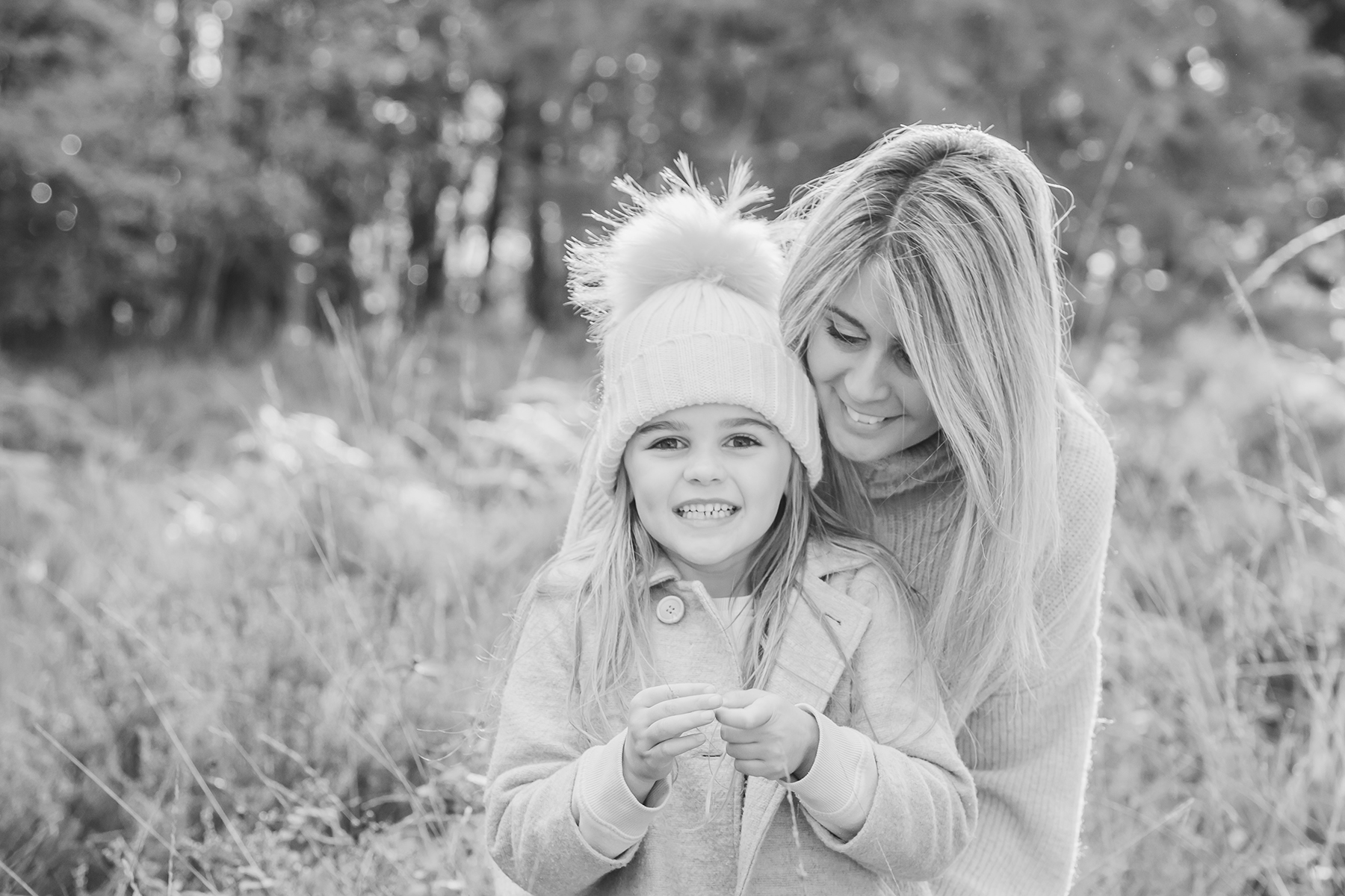 Mum and Daughter together in a forest location smiling