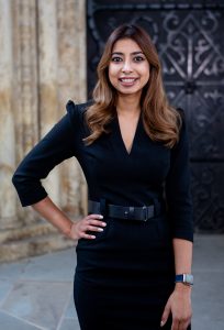 Personal Branding photo of a woman lawyer stood in front of building