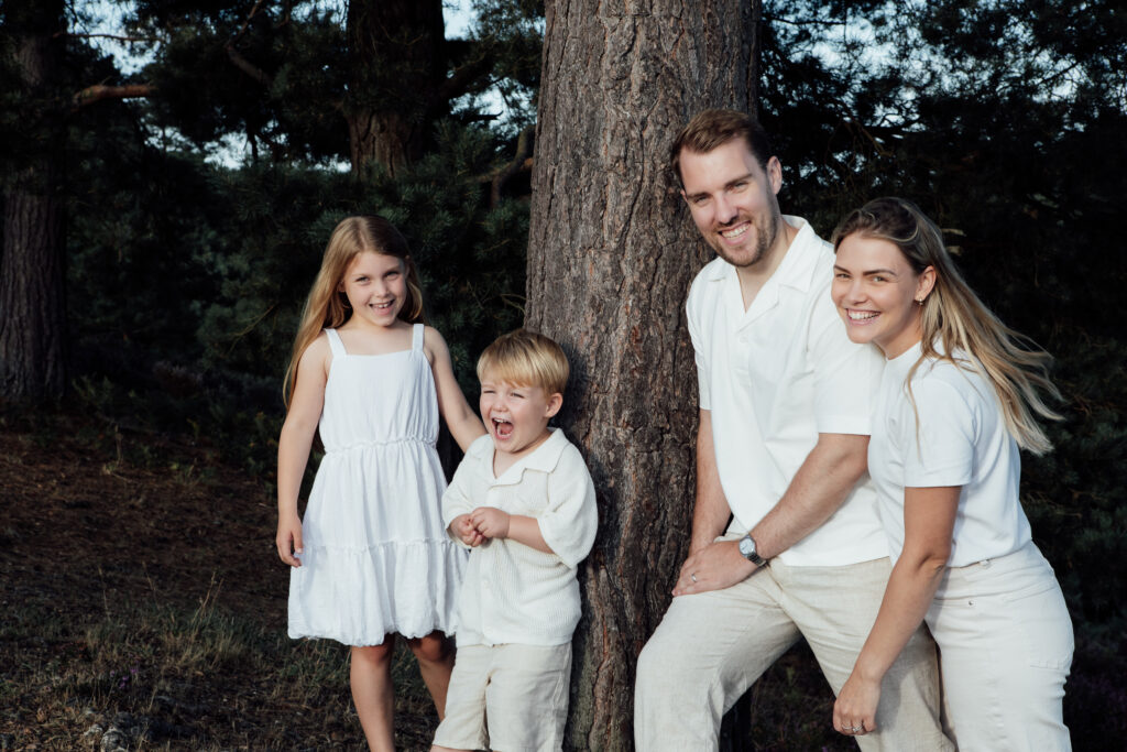 Family of four in forest at Golden Hour