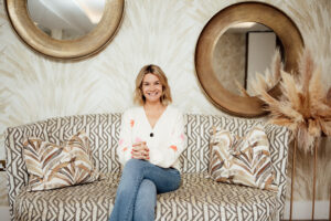 Personal Branding photo of a lady sitting on a sofa smiling at The Nici Hotel Bournemouth