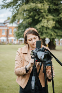 Image of Katy Ward filming in the gardens of The Royal Berkshire Hotel