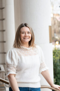 Personal Branding Photo of Dr Gemma Roberts standing at the front of The Roseate Hotel Reading.